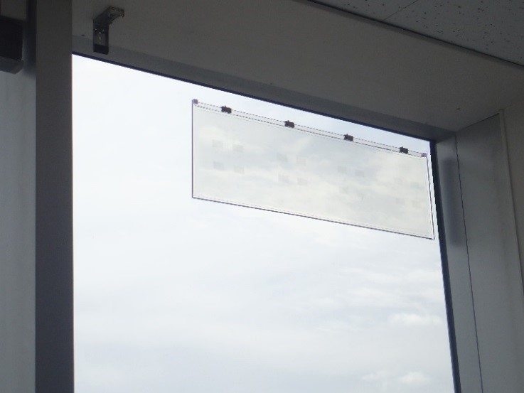 WAVEATTOCH affixed to a window (*cables not shown) (Image photo)